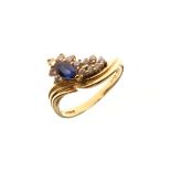 18ct gold dress ring set oval sapphire coloured stone with diamond surround, size P Condition: