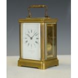 Early 20th Century brass cased carriage clock, the white enamel dial with Roman and Arabic