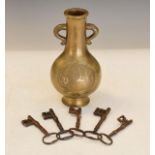 Asian bronze baluster shaped two handled vase having two reserves, each with script, together with