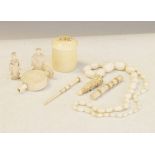 Late 19th/early 20th Century ivory items including; cylindrical box, two chess pieces, bead necklace