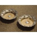 Pair of early 20th Century good quality silver plated coasters having cast grapevine borders