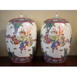 Pair of Chinese Famille Rose porcelain ovoid jars and covers, each decorated with figures in a