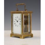 French brass cased carriage clock, the white enamel dial with Roman numerals Condition: