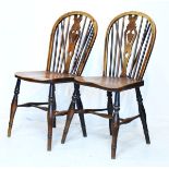 Pair of ash, elm and beech Windsor side chairs, each having a hard seat and standing on turned