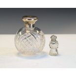 Cut glass globular smelling salts bottle, the silver hinged cover with indistinct hallmarks together