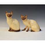 Two Sylvac figures of Siamese cats No's 5107 and 5111 together with two books relating to Sylvac