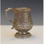 Late 19th/early 20th Century Indian white metal baluster shaped tankard having allover decoration