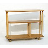 Ercol light elm and beech trolley bookcase Condition: