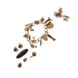 9ct gold charm bracelet, neck chain with M pendant, pair of earrings and a brooch, 34g approx