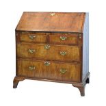 Early 18th Century walnut bureau, the fall flap opening to reveal a fitted interior, two short and