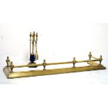 Brass fire curb and a brass companion set Condition: