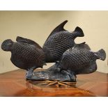 Bronze figure depicting three fish Condition: