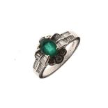 18ct white gold dress ring set central emerald coloured stone having brilliant cut diamond border