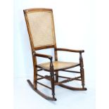 Victorian beech rocking chair having a split cane seat and back Condition: