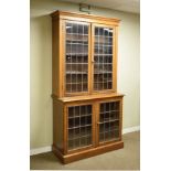 Early 20th Century oak two section bookcase fitted four leaded glass doors Condition: