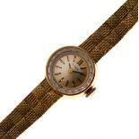 Lady's Tissot yellow metal cased wristwatch, the conforming Tissot bracelet stamped .750 Condition:
