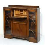 1930's period oak bureau bookcase, the centre section fitted fall flap with drawer and cupboards