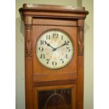 Early 20th Century Continental oak longcase clock having silvered dial with Arabic numerals, the