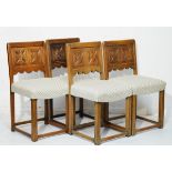 Set of four reproduction carved oak panel back dining chairs, the stuffed seats upholstered in off-