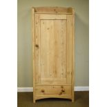 Natural pine tray top tall cupboard, the panelled door opening to reveal four shelves, one long