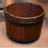 Steel bound oak log bin on brass paw feet Condition: