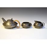 Liberty & Co English Pewter three piece tea set designed by Archibald Knox, having stylised
