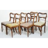 Set of six Victorian rosewood buckle back dining chairs, each having a carved back bar, drop-in seat