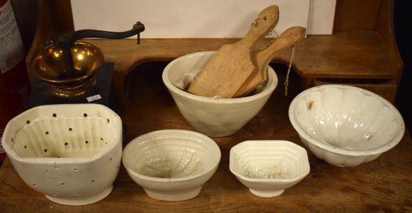 Five off-white glazed pottery jelly moulds, a vintage coffee grinder and four butter pats Condition: