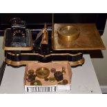 Large set of vintage cast iron balance scales having a brass platform and with various brass and