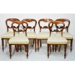 Set of six Victorian mahogany buckle back dining chairs, each having a carved back bar, stuffed seat