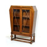 1930's period oak cabinet bookcase fitted three shelves enclosed by a pair of glazed doors and