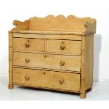 Stripped pine tray top chest of two short and two long drawers on bun feet Condition: