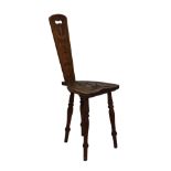Early 20th Century carved oak spinning chair standing on tapered turned supports Condition: