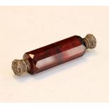 Late 19th/early 20th Century ruby glass double ended scent bottle having embossed silver screw and
