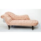 Victorian scroll end chaise longue upholstered in pink floral patterned deep buttoned brocade and