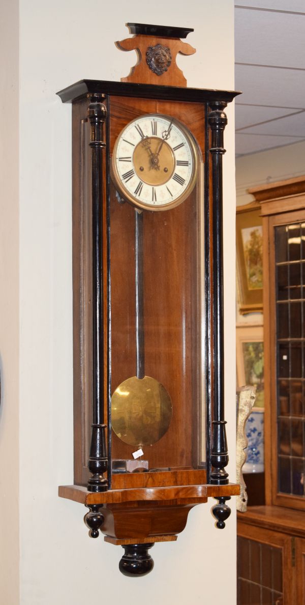 Late 19th Century walnut and ebonised cased Vienna style wall clock, the brass dial having an off-