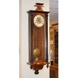 Late 19th Century walnut and ebonised cased Vienna style wall clock, the brass dial having an off-