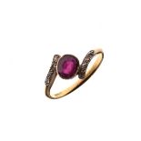 Cross over design dress ring set central garnet coloured stone with diamond shoulders, the shank