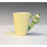 Clarice Cliff off-white glazed mug, the handle formed as a pixie Condition: