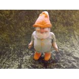 A mid 20th century fabric figure of a Heigh-Ho Dwarf with musical movement playing the song, 11"