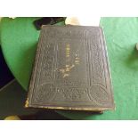 A large leather bound copy of The Holy Bible containing old and new testaments 1874, marked on the