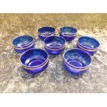 A set of 7 early 20th century Cobalt blue bowls with gilt banded decoration.