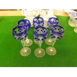 A set of 5 pedestal Hock glasses with cut blue bowls and one other pedestal Hock glass of similar