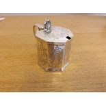 A Victorian silver octagonal mustard pot with etched foliage decoration and hinged cover and blue