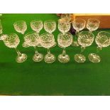 A suite of 12 Stuart cut glass pedestal Hock glasses 8 with sunburst base and 4 with plain base of