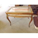 An early 19th century rosewood inlaid table vitrine with ormolu mounts and cabriole legs having