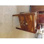 An antique mahogany washstand with tray top, 2 drawers and lift flap cupboard, 19 1/2" x 17".