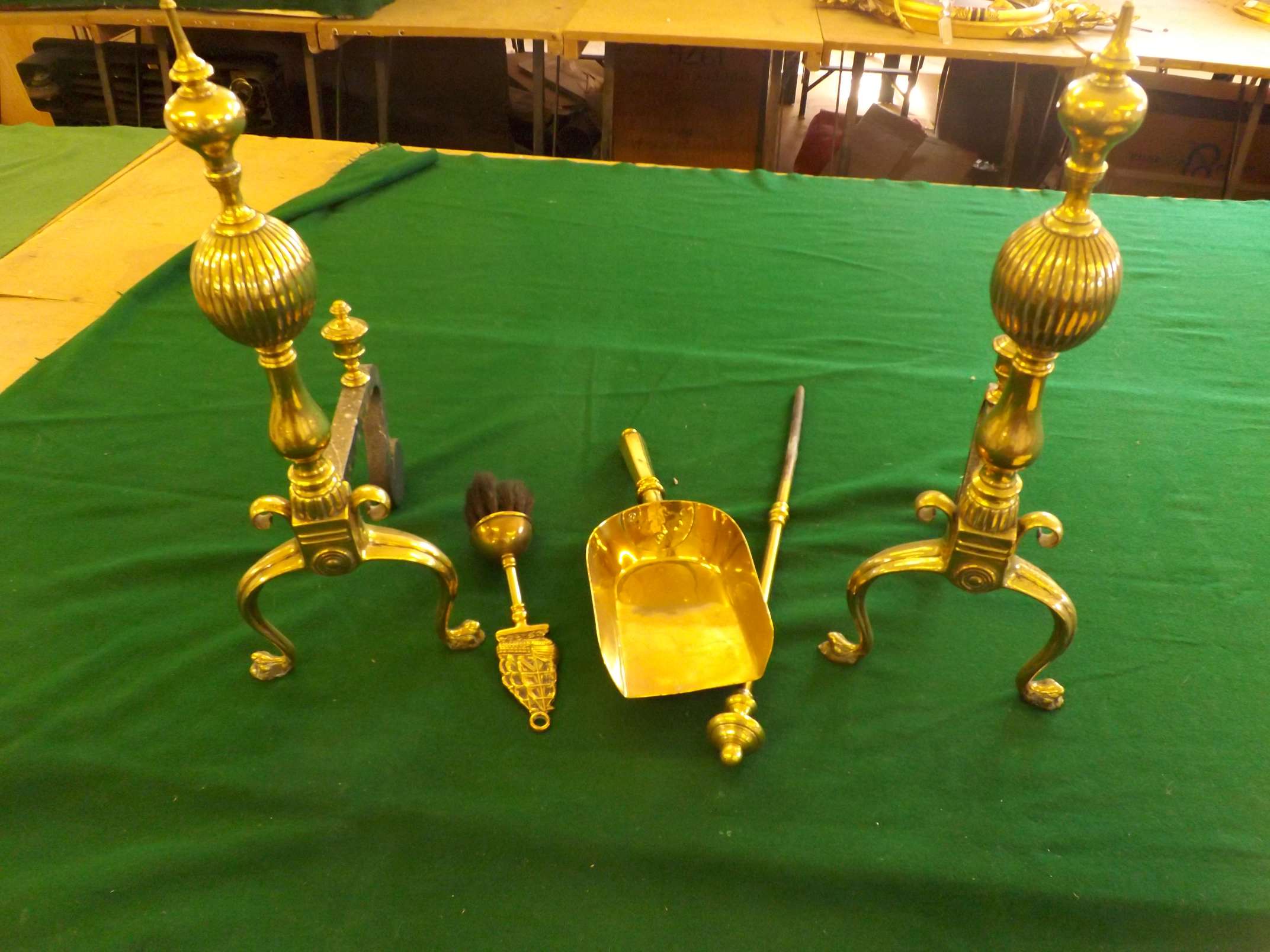 A pair of Victorian brass and wrought iron firedogs together with brass shovel, poker and brush.