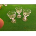 Three unusual 19th century pedestal glasses with cut and knop design.