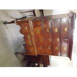 An 18th century chest on stand with shaped front on claw and ball feet, having 3 long drawers and